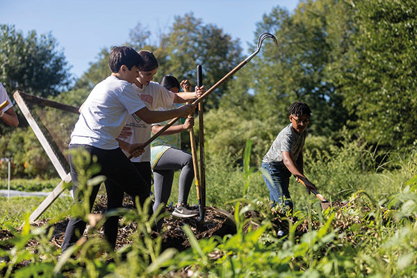 Earthworks Youth Program students learn about different types of soil.